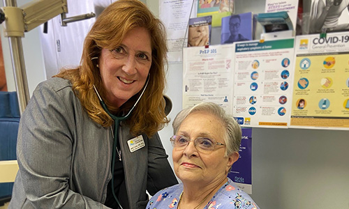 Janice Chupka, VBA Dir. of Clinic Services, picture with patient